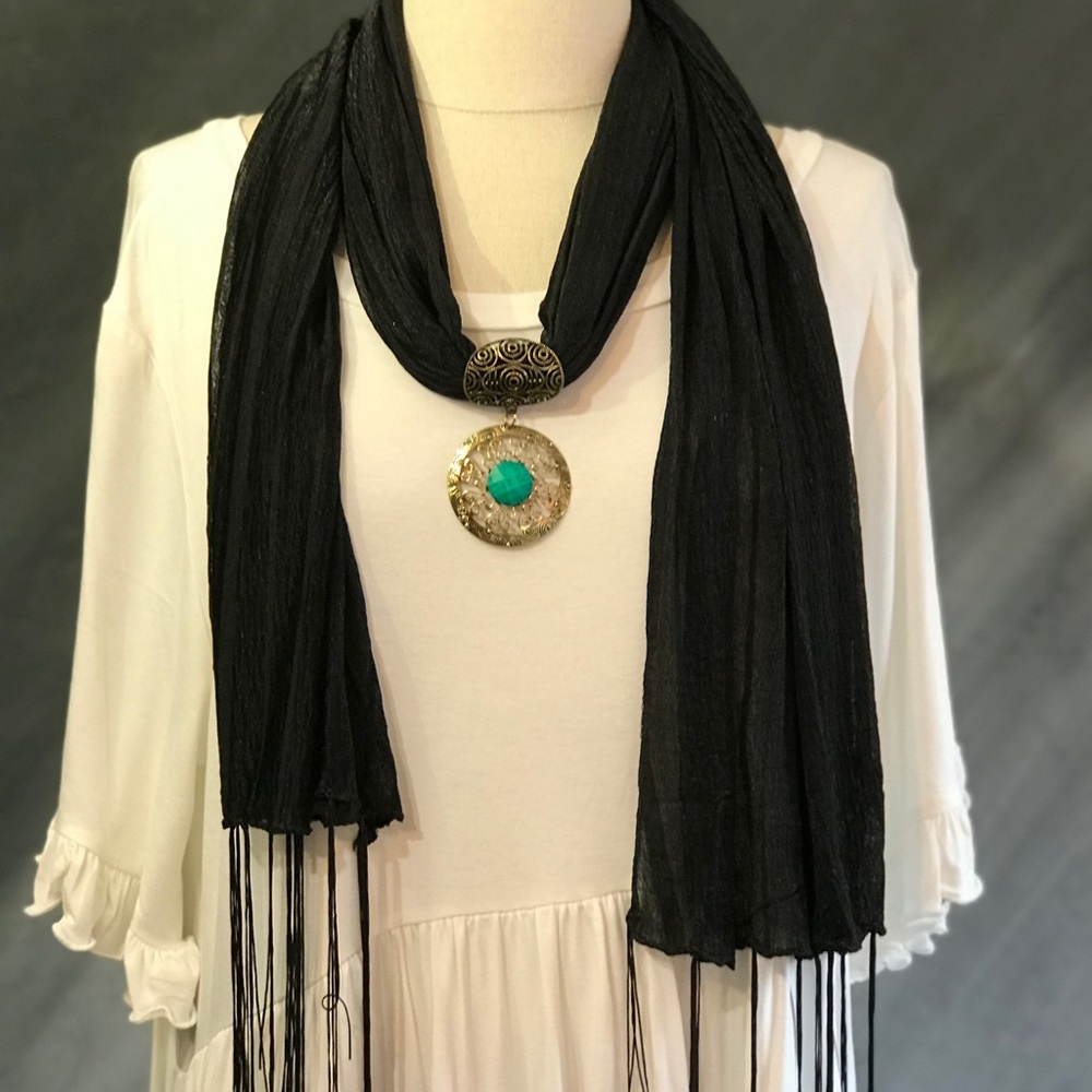 Black scarf with bronze medallion